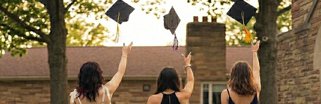 Graduates toss their mortar caps in celebration of their graduation
