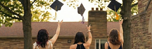 Graduates toss their mortar caps in celebration of their graduation