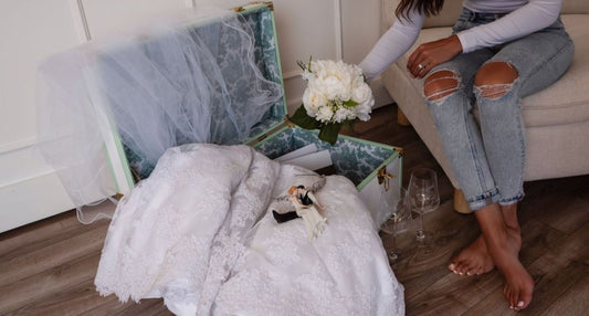 A woman appreciates her wedding mementos on display.