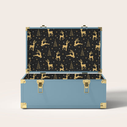 Blue storage trunk with gold reindeer and Christmas tree interior pattern