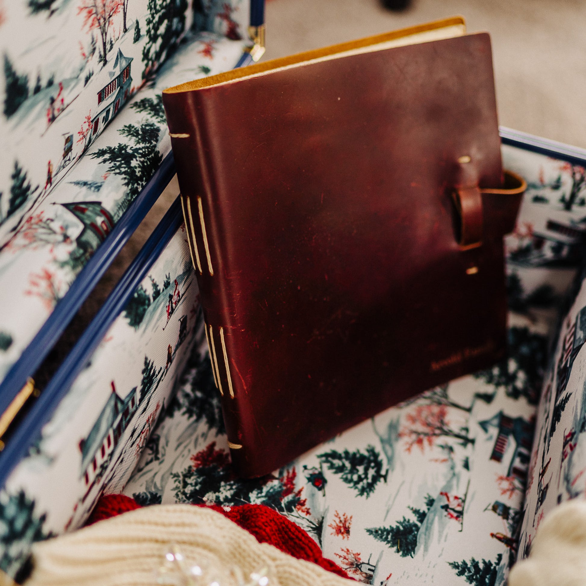 Brown leather notebook in a patterned trunk