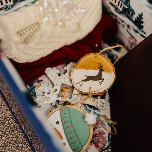 Several decorative Christmas ornaments in a trunk