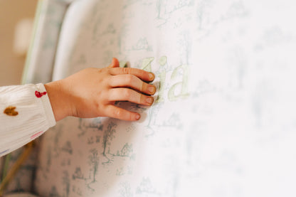 Child hand touching a interior pattern of a trunk