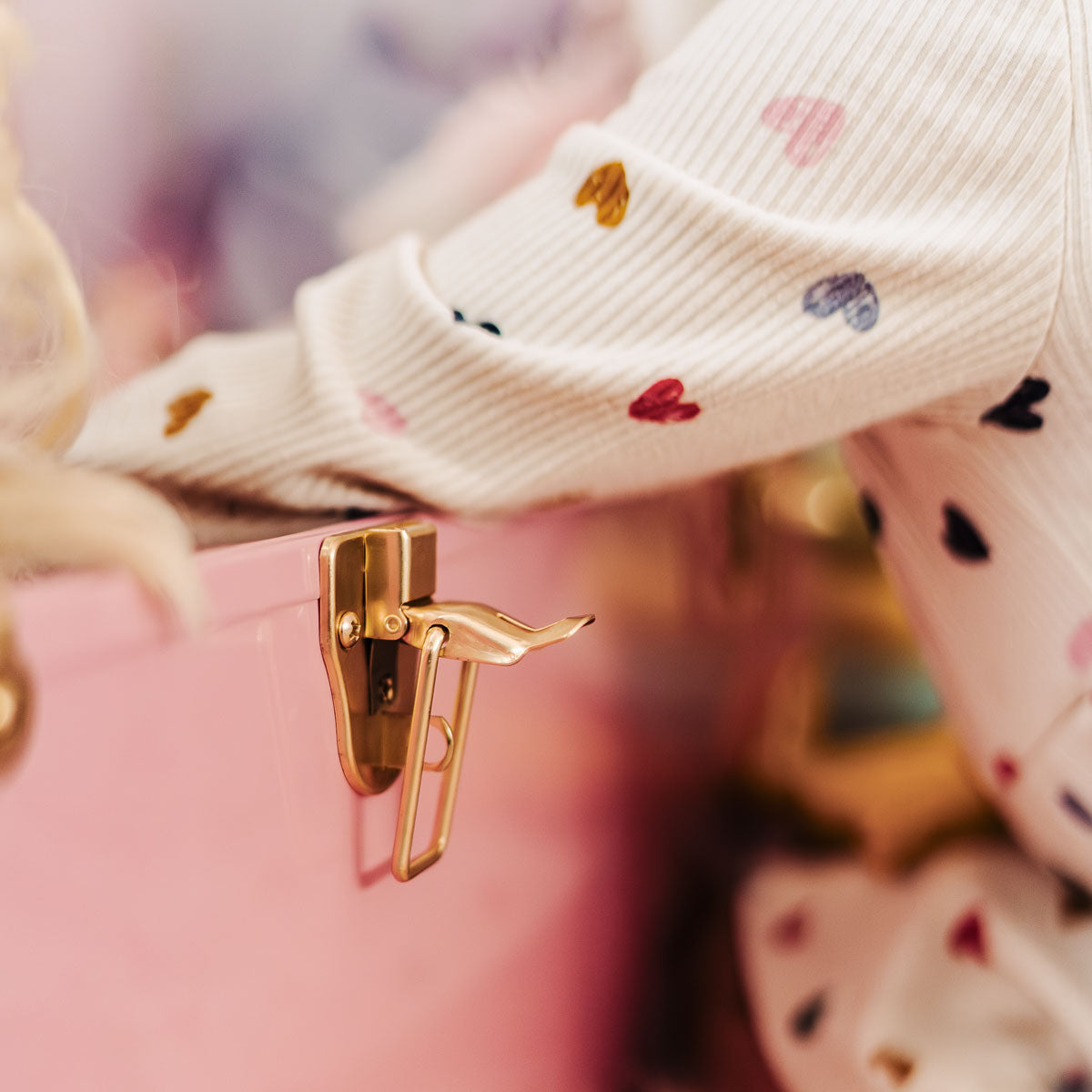 Close-up of a pink trunk with a gold hardware.